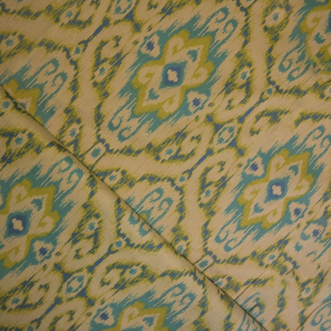 Patterned fabric with green and blue design on a cotton fabric
