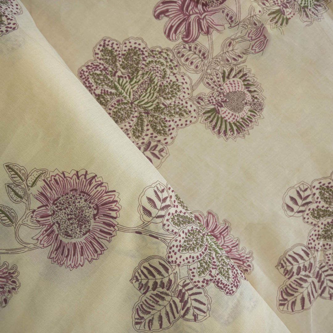 Floral patterned fabric with purple flowers and green leaves on a beige background