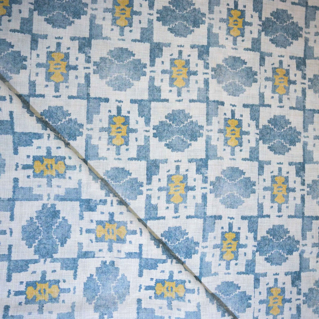 Patterned linen fabric with blue and yellow design 