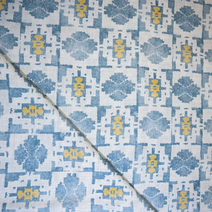 Patterned linen fabric with blue and yellow design 