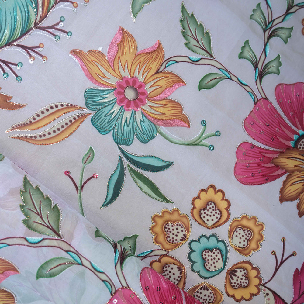 Close-up of floral embroidery with colorful flowers and leaves on a white background