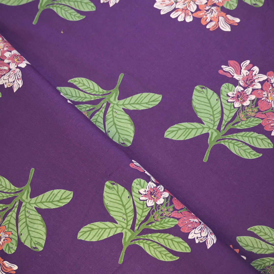Floral and leaf pattern on a purple fabric 