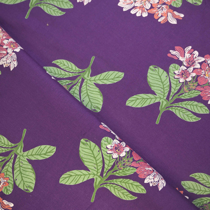 Floral and leaf pattern on a purple fabric 