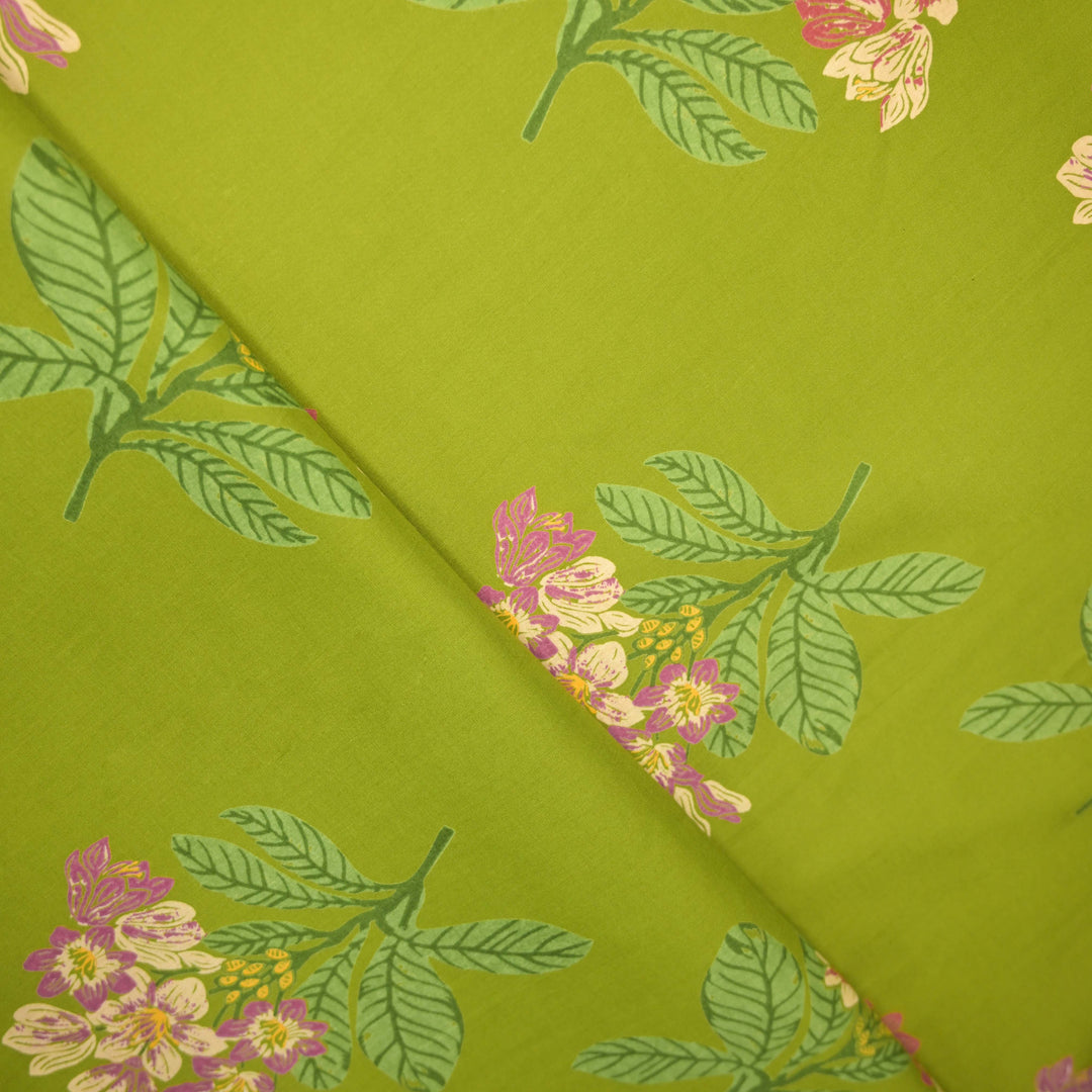 Floral and leaf pattern on green fabric