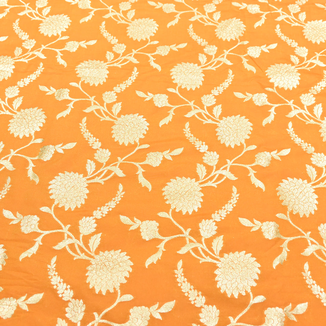 vibrant tangerine orange base with shimmering gold floral brocade.