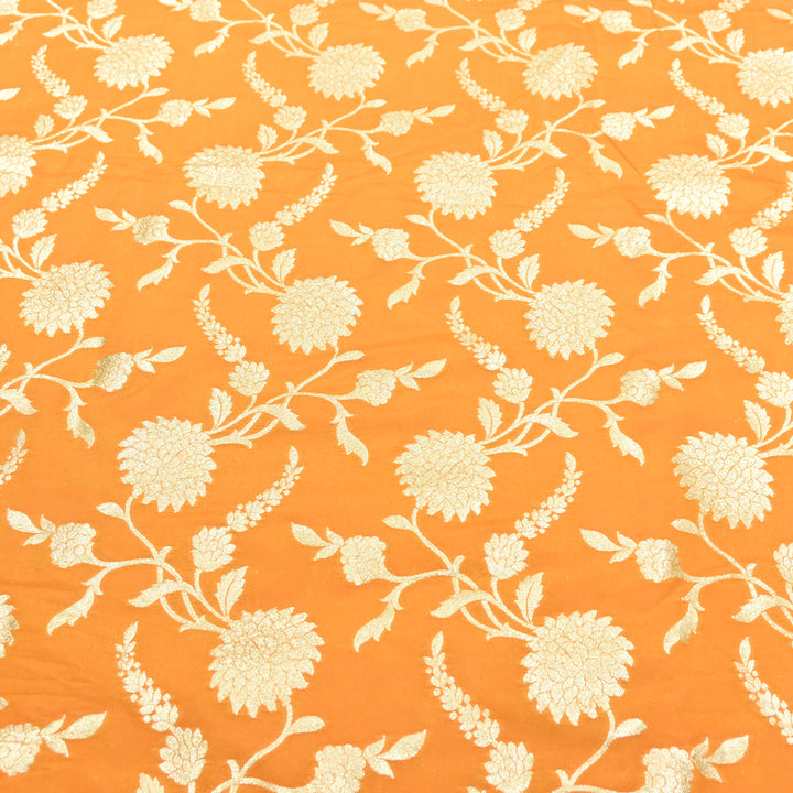 vibrant tangerine orange base with shimmering gold floral brocade.