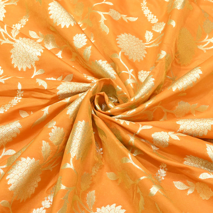 vibrant tangerine orange base with shimmering gold floral brocade.