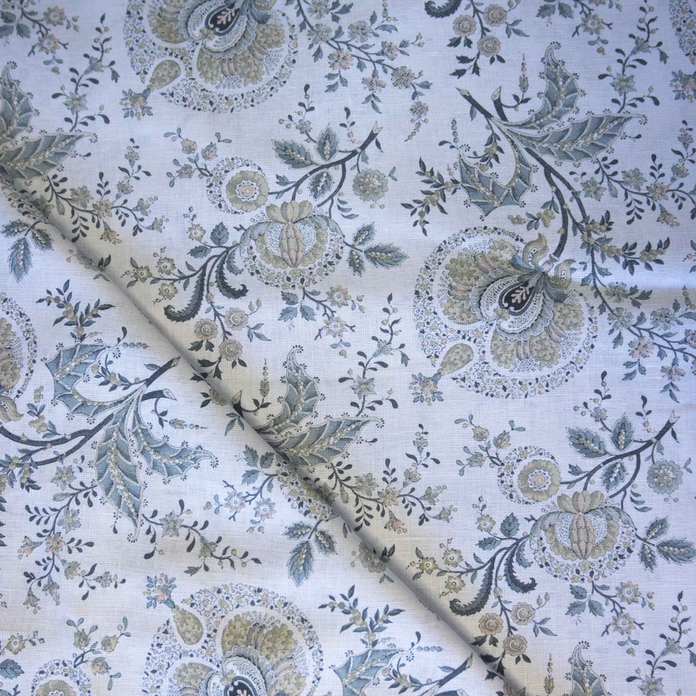 Floral and paisley patterned fabric with a white background