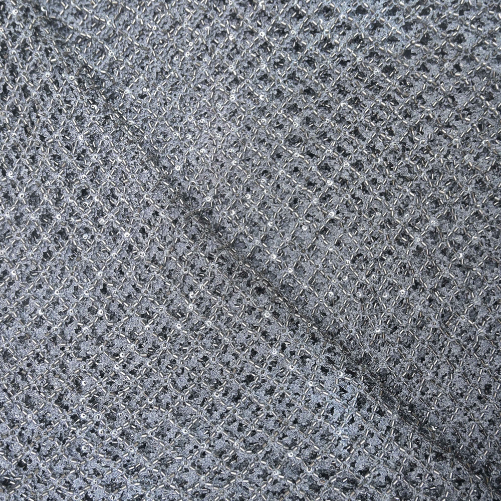 Close-up of a gray net fabric with a diamond pattern