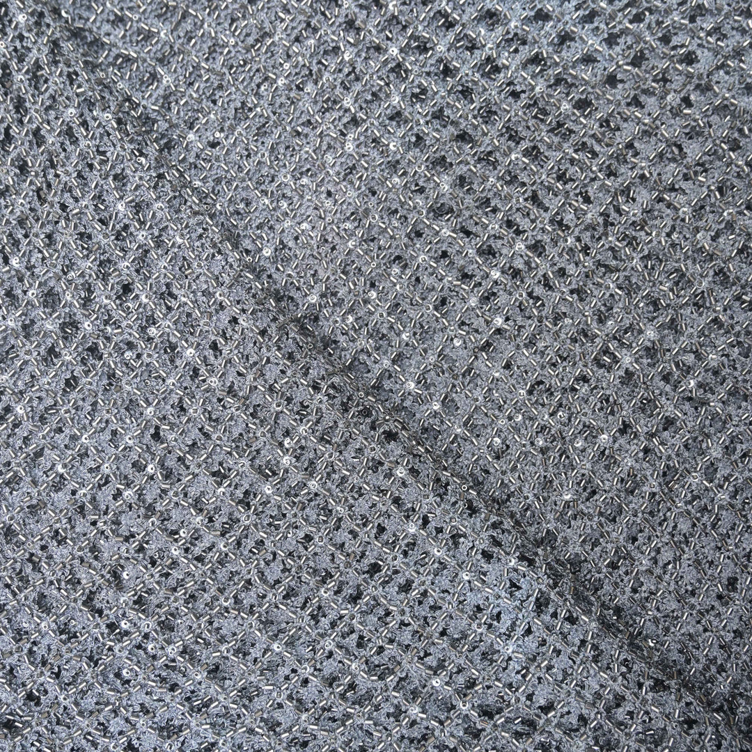 Close-up of a gray net fabric with a diamond pattern