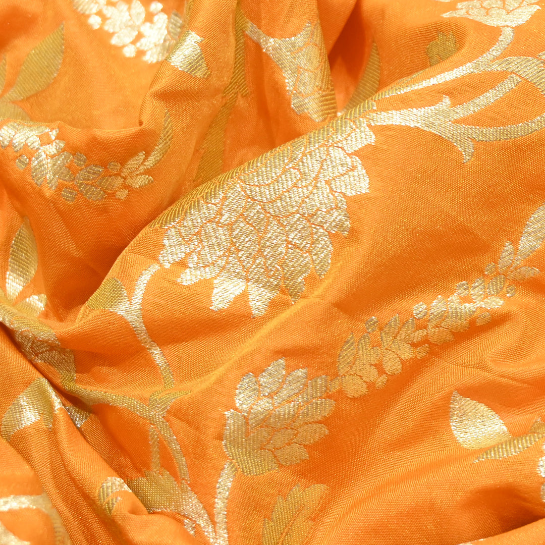 vibrant tangerine orange base with shimmering gold floral brocade.