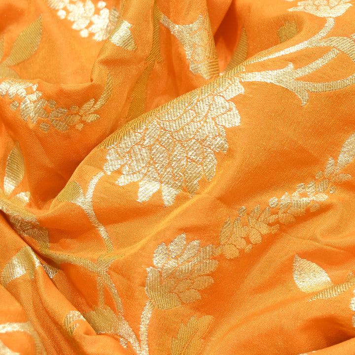 vibrant tangerine orange base with shimmering gold floral brocade.