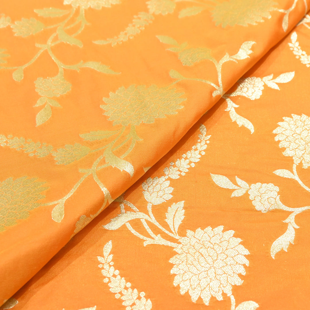 vibrant tangerine orange base with shimmering gold floral brocade.