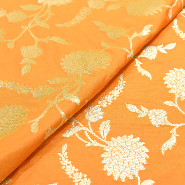 vibrant tangerine orange base with shimmering gold floral brocade.