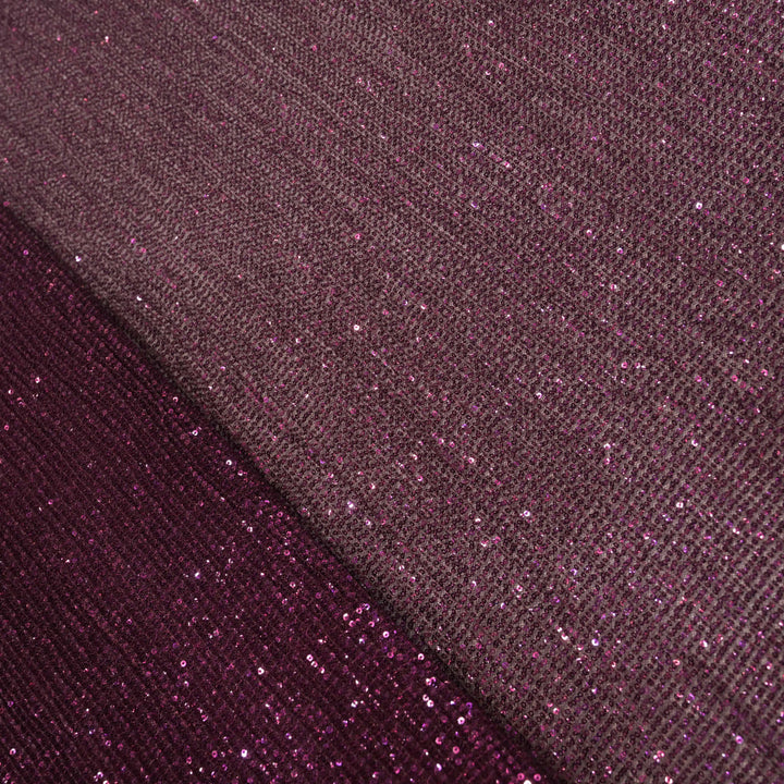 Close-up of purple glittery fabric with a textured pattern