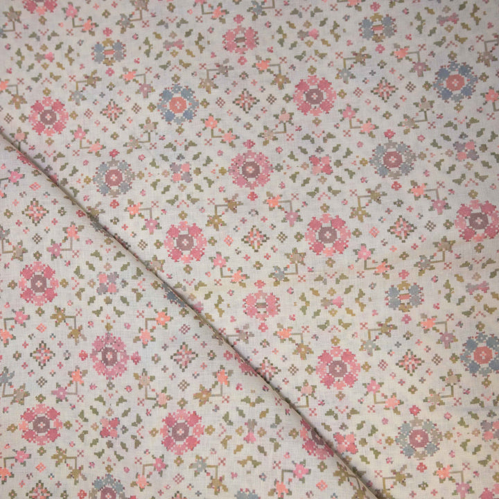 Floral patterned fabric with pink and blue flowers on a light background