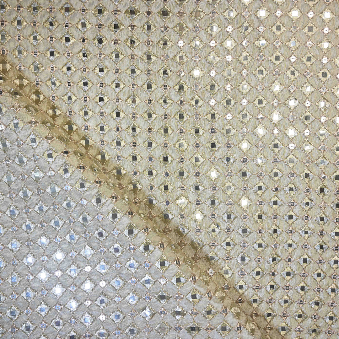 Mosaic pattern with a diagonal brown stain on a textured surface