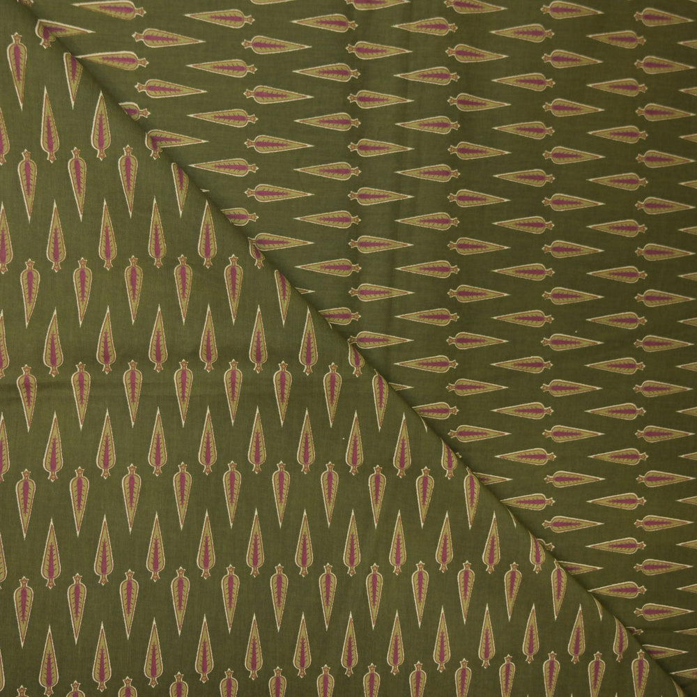 Green fabric with a repeated pattern of red and beige shapes