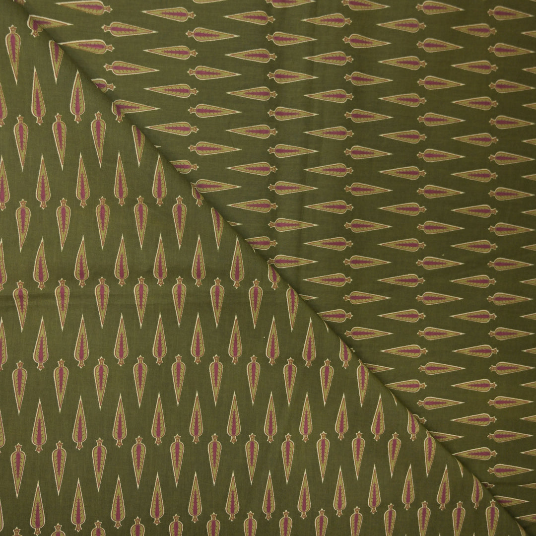 Green fabric with a repeated pattern of red and beige shapes