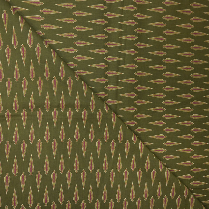 Green fabric with a repeated pattern of red and beige shapes