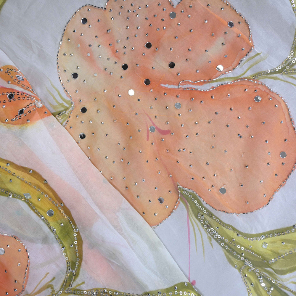 Decorative fabric with floral pattern and sequin embellishments on a light background